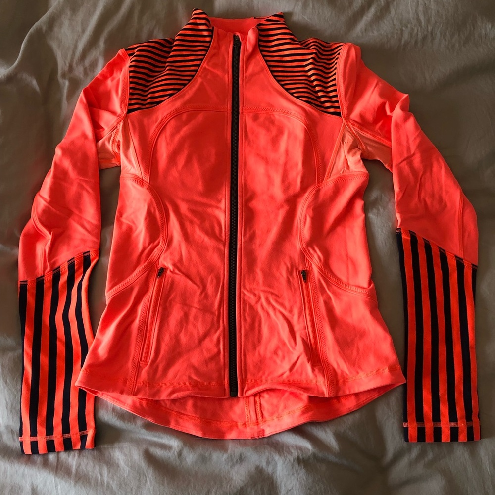 Lululemon orange and black zip up jacket. Size 6.